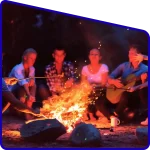 Tourists enjoy Campfire in hotel ground