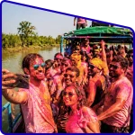 Tourists playing Holi on boat in Sundarban river